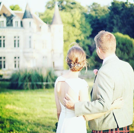 Groom and bride photographed at their French wedding