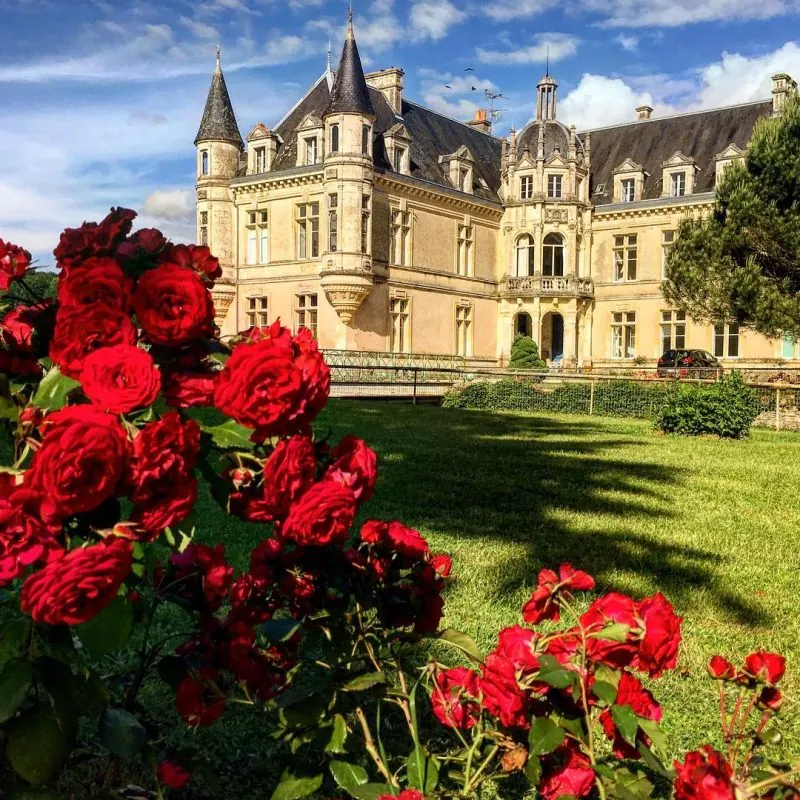 Château de Bourneau in the Vendée, its Renaissance turrets seen across the rose garden